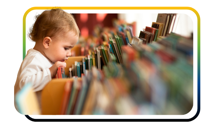 Image of child looking at books