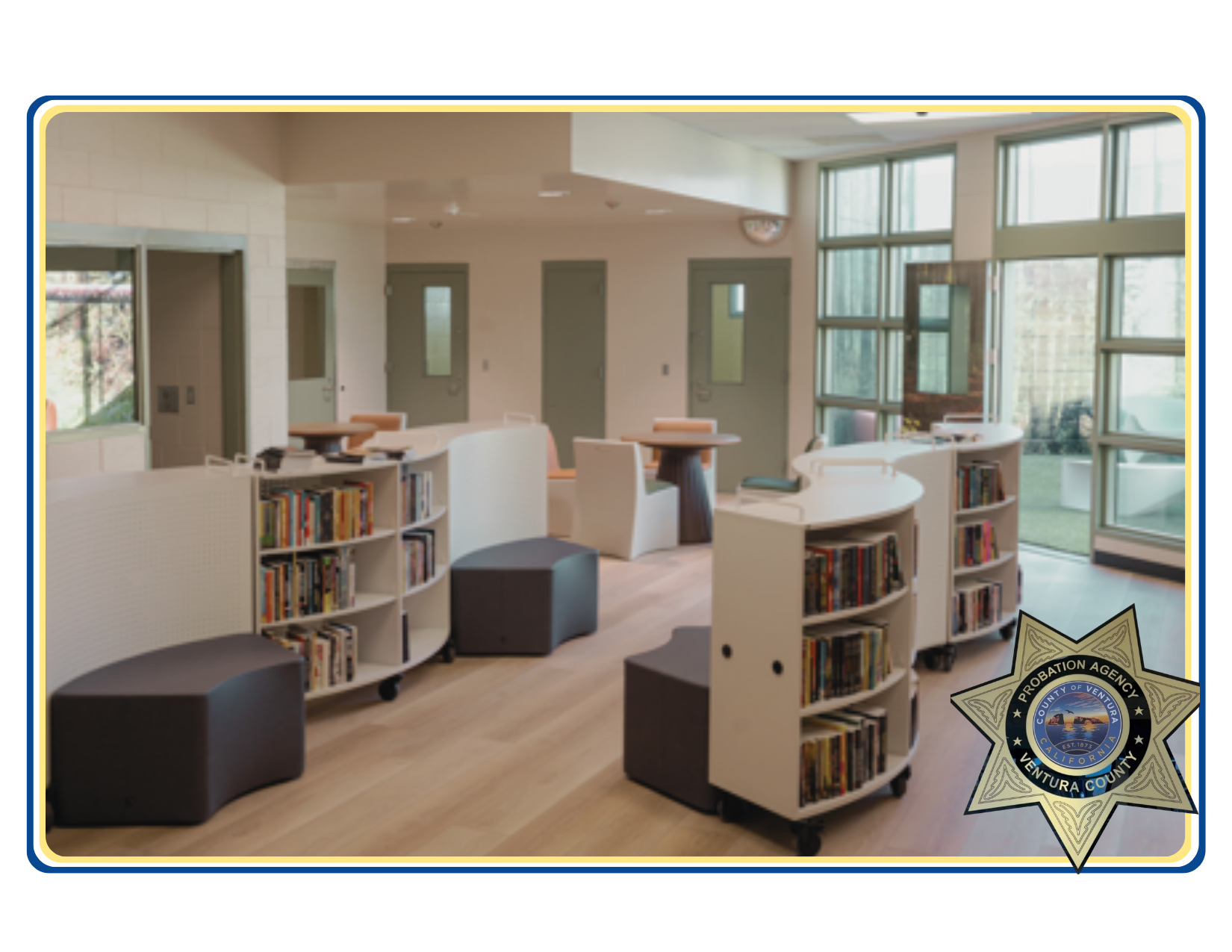 Photo of Juvenile Facilities Library with books. A Probation Department Badge is also seen