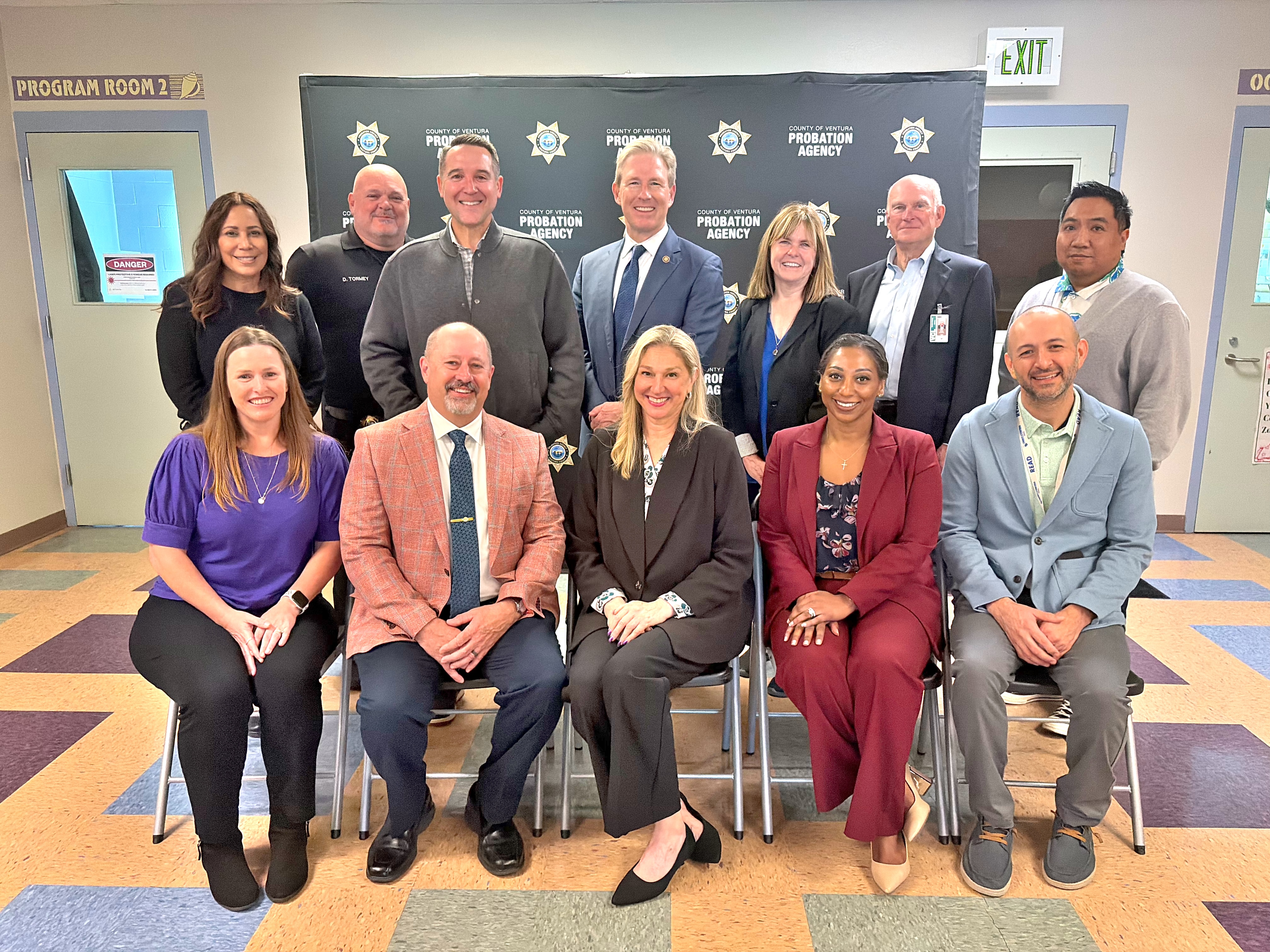 Picture of County officials and community leaders at the Ribbon-cutting ceremony of Next Chapter Library