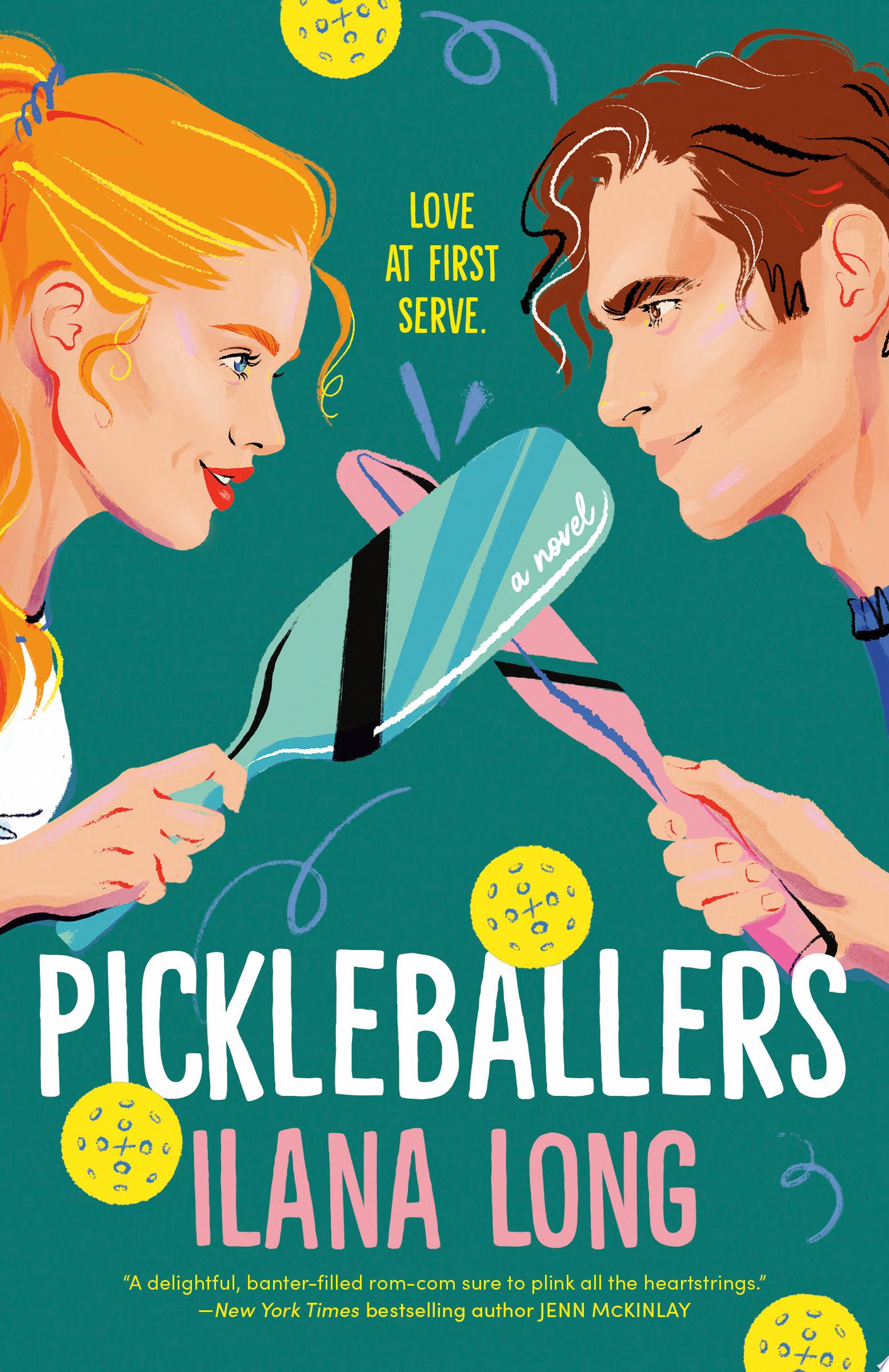 A man and a woman facing each other while holding pickle ball paddles 