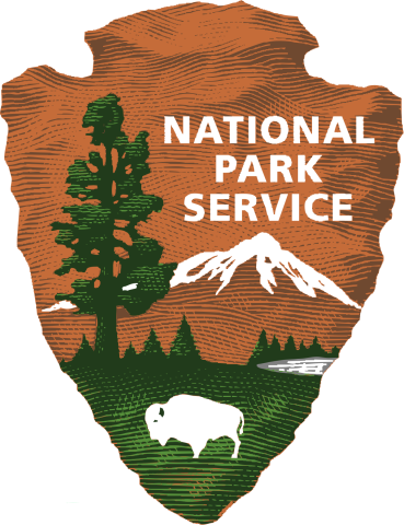 logo of the United States National Park service, a buffalo and tree with mountain in background