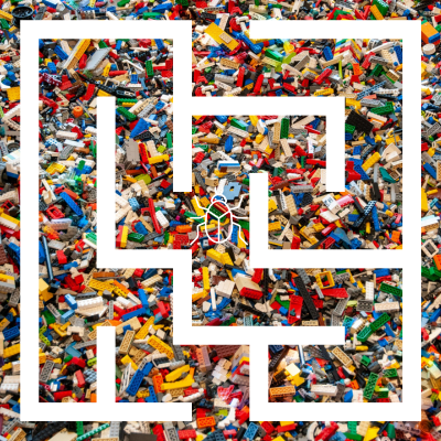 A large maze outline with lego bricks as a background