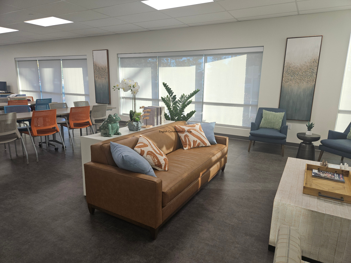 community room with a couch, tables and chairs for adult programming. Call (805) 677-7160